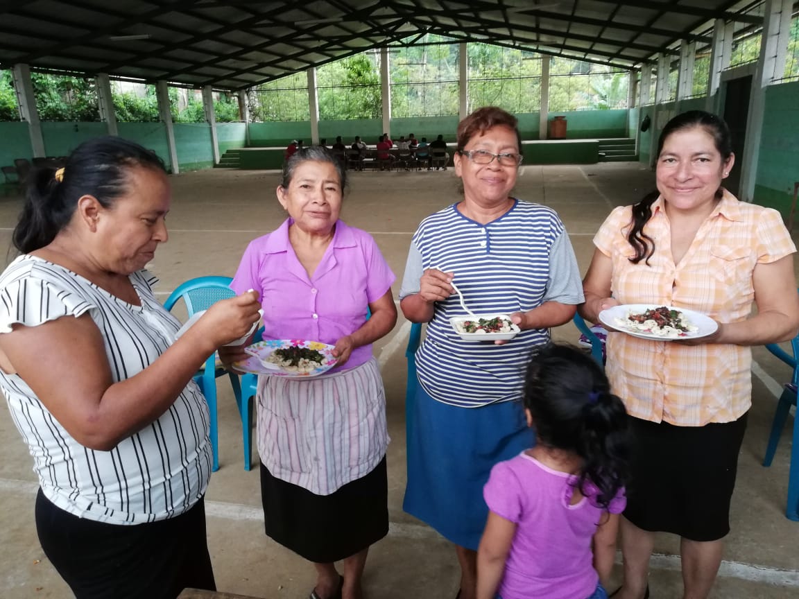 Women enjoy meal with beans